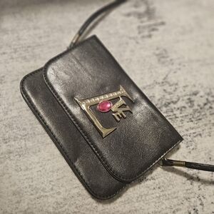 Elegant Black Leather Clutch with Gold Accents